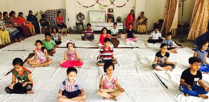 Children meditating together in a Foundation session
